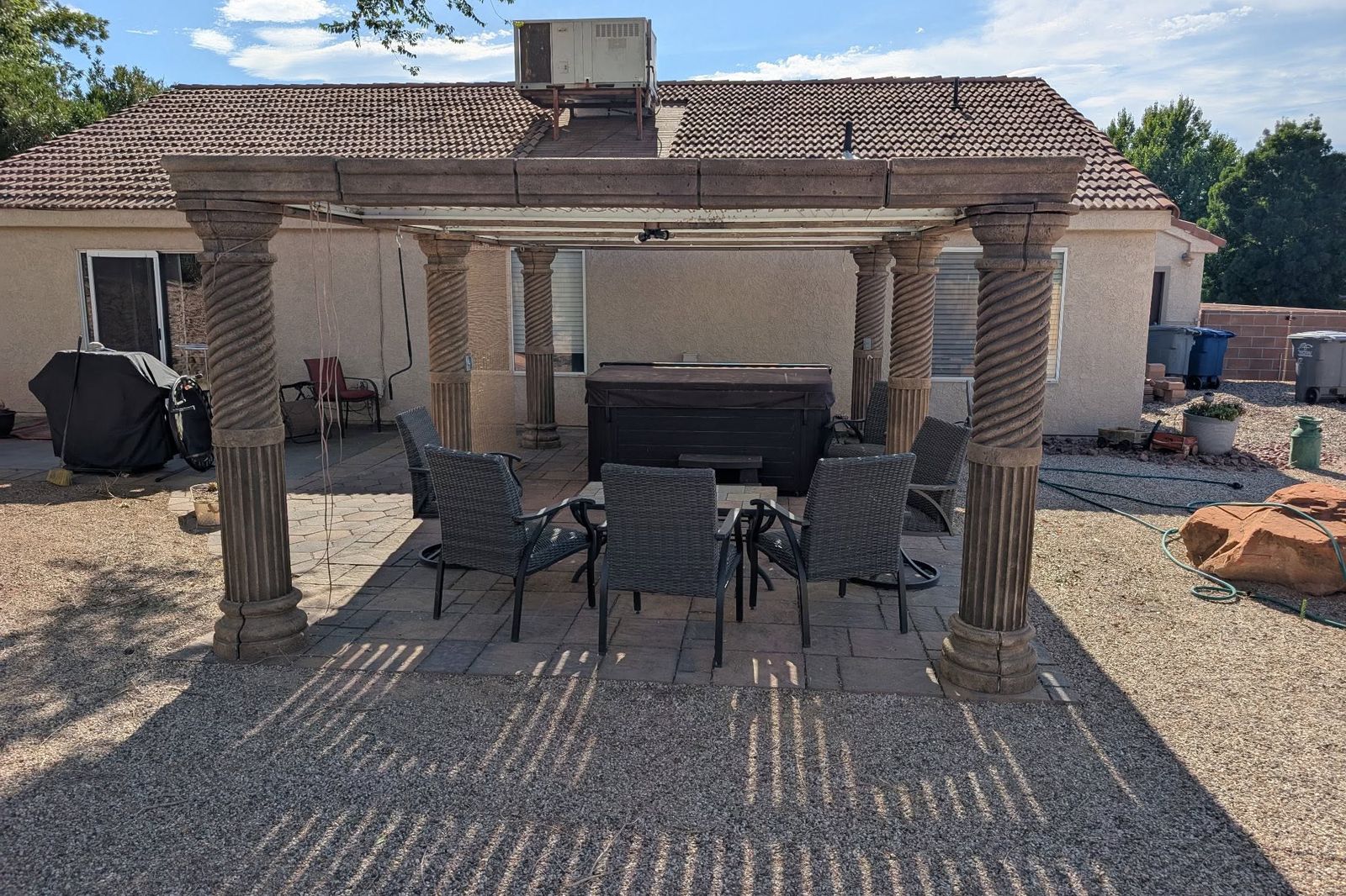 A patio pergola carried on spiral fluted foam columns